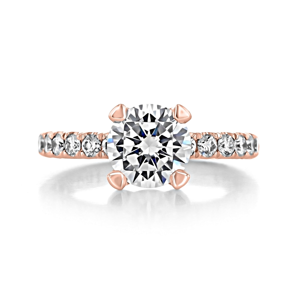 A rose gold Petite Crescent | Round Solitaire Engagement Ring - HT254525RD8PK featuring a round diamond and smaller diamonds set along the band.
