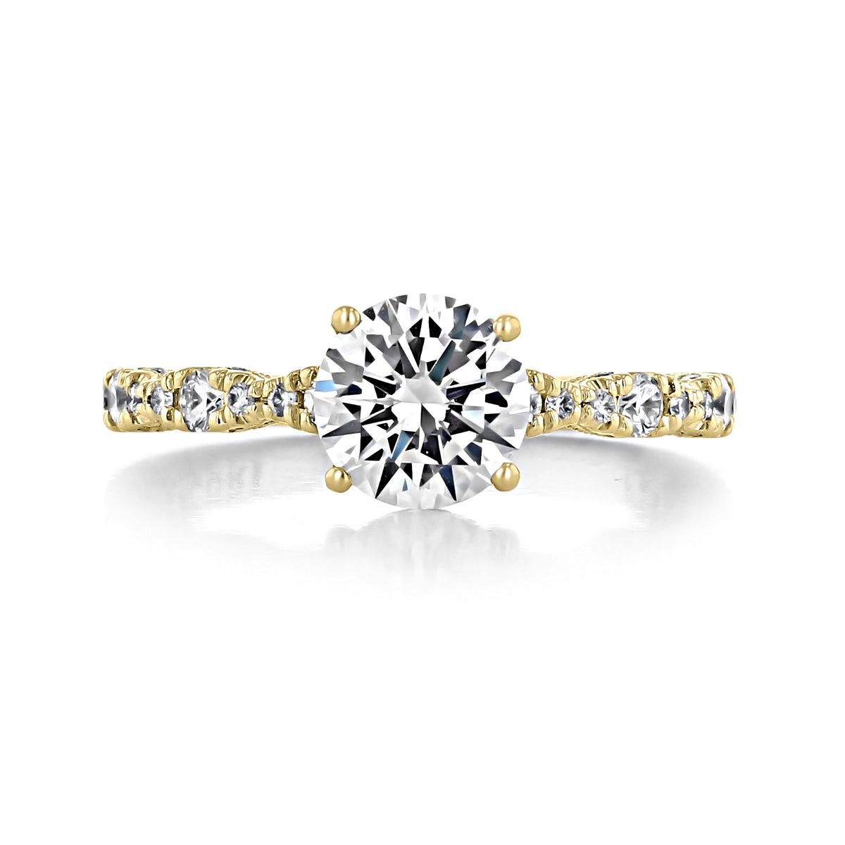 A yellow gold Petite Crescent | Round Solitaire Engagement Ring - HT2559RD7Y featuring a round-cut solitaire diamond set on a band accented with smaller round diamonds.
