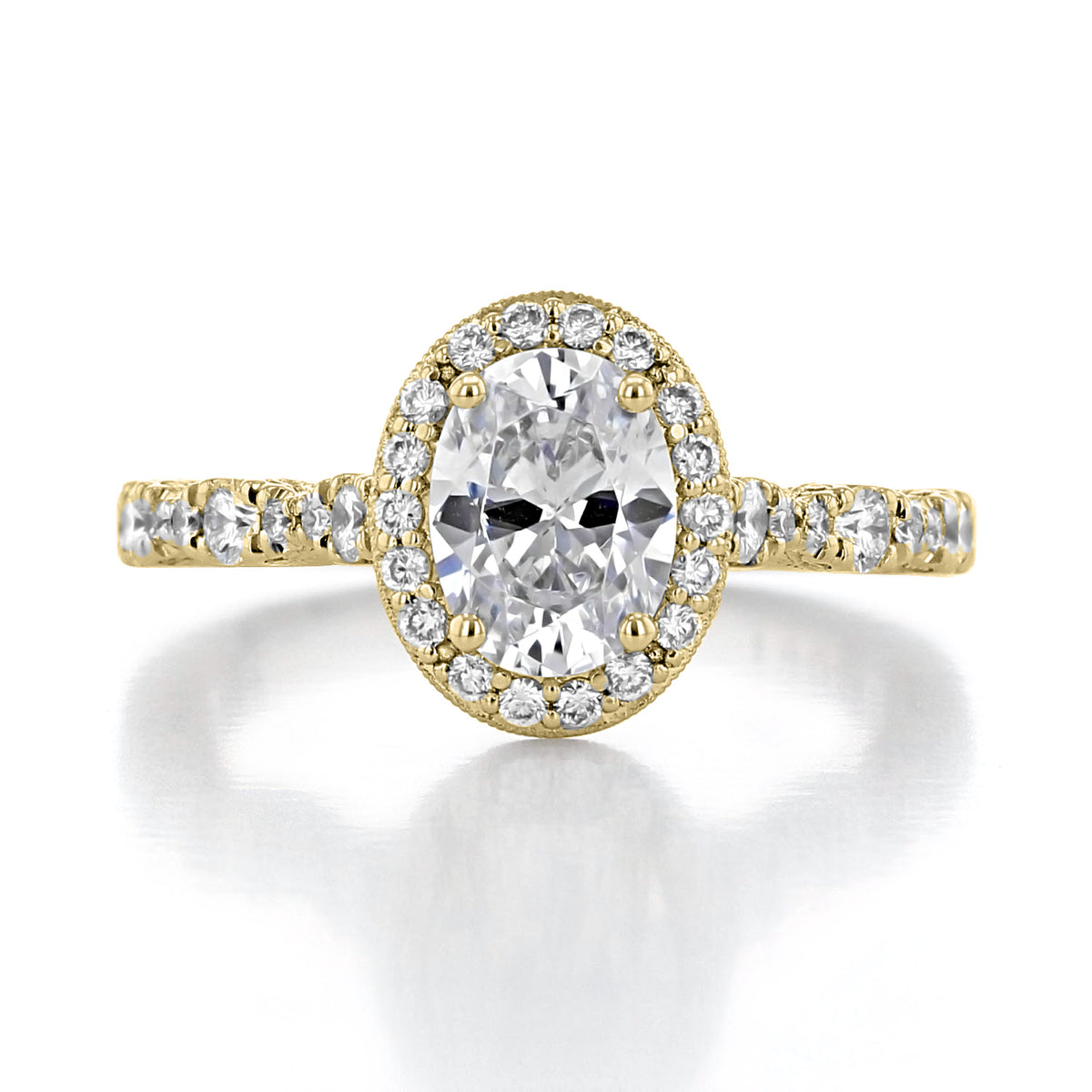 Petite Crescent | Oval Solitaire Engagement Ring - HT2560OV8X6Y in gold, featuring an oval-shaped diamond center surrounded by a halo of small round diamonds on a pavé band.