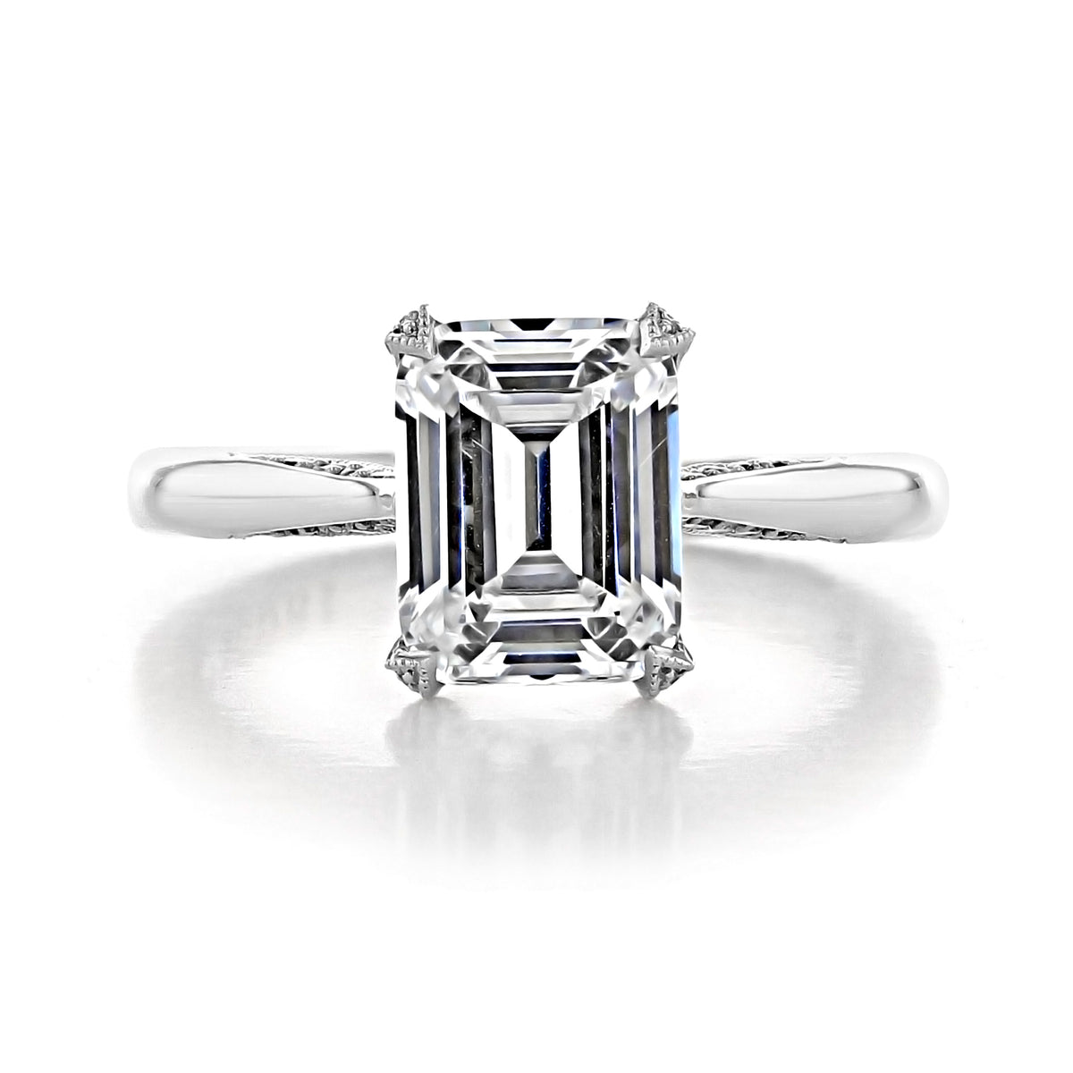 RoyalT | Emerald Solitaire Engagement Ring - HT2625EC9X7 featuring an emerald-cut stone in silver-toned metal with diamond accents on the prongs.
