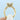 Royal T Emerald Solitaire Engagement Ring HT2625EC9X7Y in yellow gold featuring an emerald-cut center stone with diamond-encrusted prongs and shank.