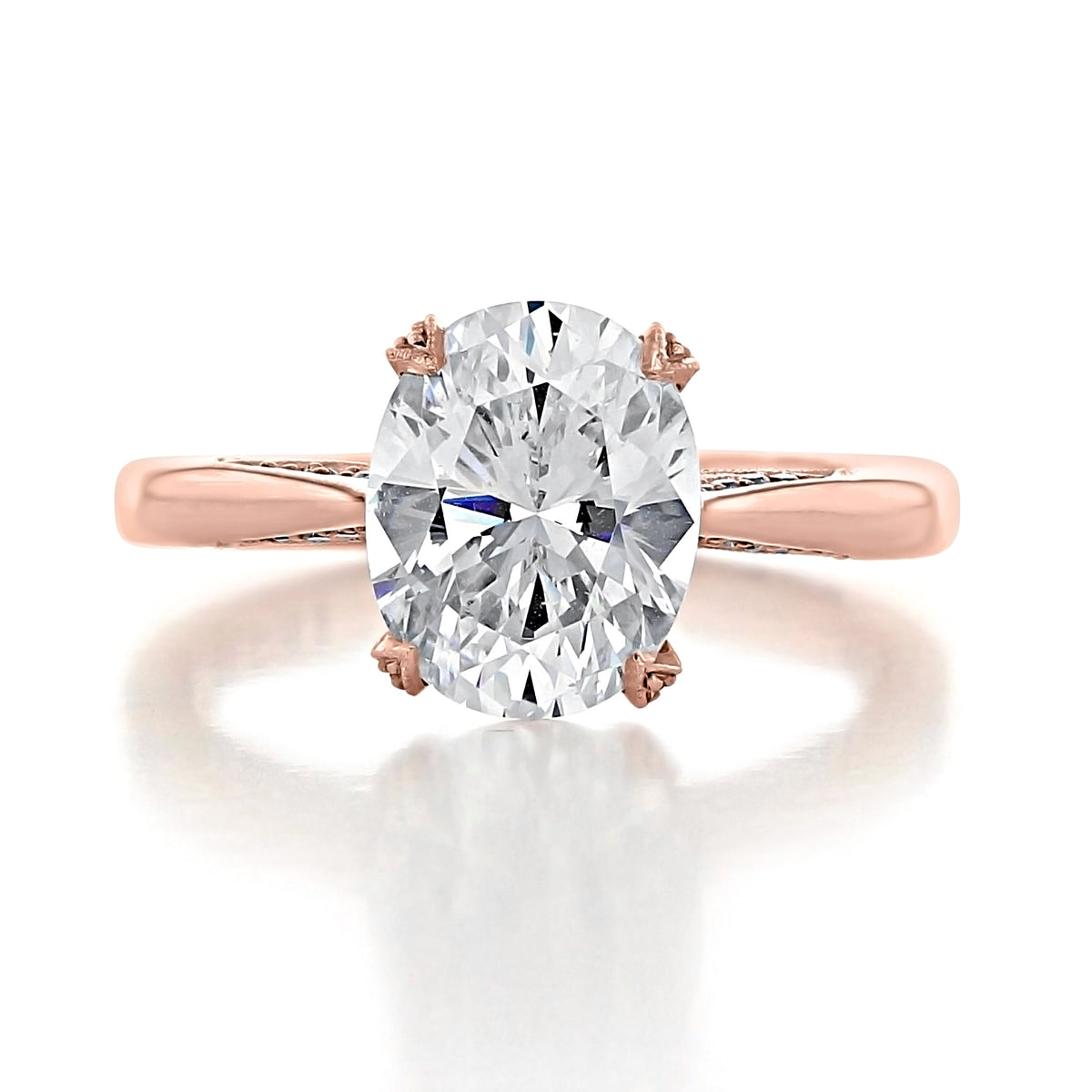 Oval-cut solitaire diamond ring set in a rose gold RoyalT | Oval Solitaire Engagement Ring - HT2625OV10X8PK Tacori band.