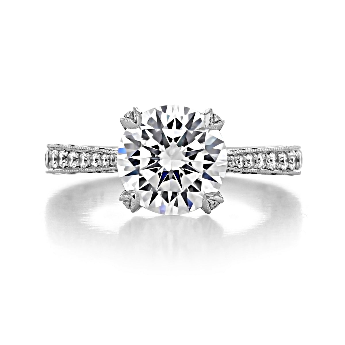 Tacori RoyalT Round Pavé Engagement Ring (HT2626RD9) featuring a round brilliant-cut solitaire diamond on a pavé-set band with decorative metalwork detailing.