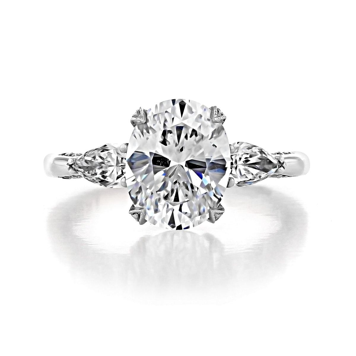 Tacori RoyalT | Oval Solitaire Engagement Ring - HT2628OV10X8 featuring an oval center gemstone with a pear-shaped diamond on each side, set on a metal band.