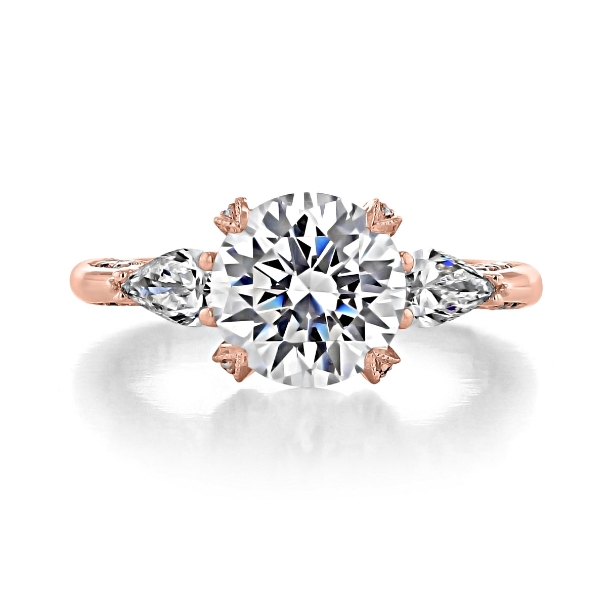 Tacori Royal T | Round Solitaire Engagement Ring - HT2628RD85PK featuring a round center diamond flanked by two pear-shaped diamonds on a rose gold band.