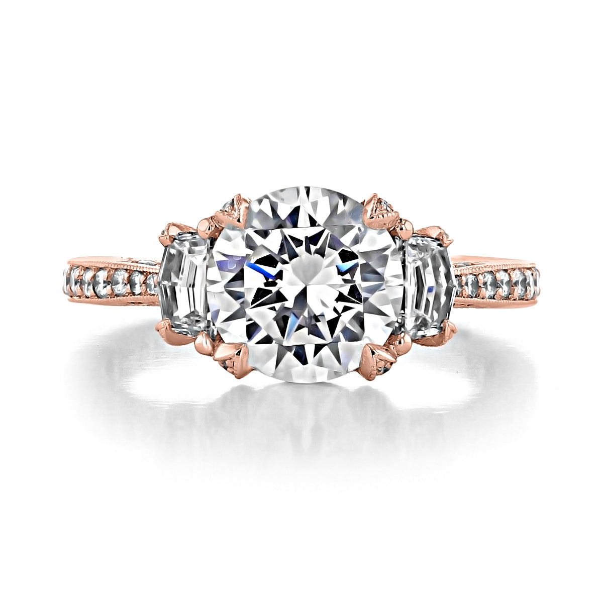 RoyalT | Round 3-Stone Engagement Ring - HT2655RD85PK featuring a large round center diamond flanked by two baguette diamonds on a rose gold band set with small round diamonds.
