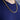 A 14K Yellow Gold 3.7MM Franco Solid Chain worn around a neck over a dark blue t-shirt.