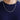 A silver rhodium plated 2.7MM round Franco chain necklace (CH27FRW-22) worn around a neck against a dark blue shirt.