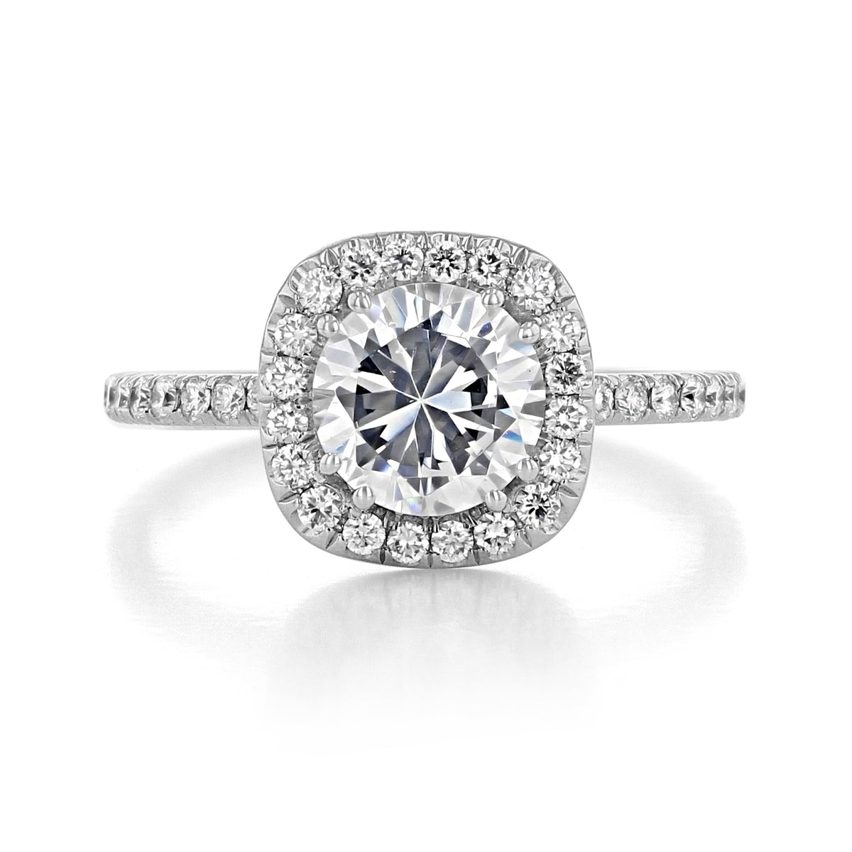 A Per Lei | Halo Engagement Ring - LE102-CU featuring a round-cut diamond, a cushion-shaped halo of micro-prong set diamonds, and a pavé-set band.