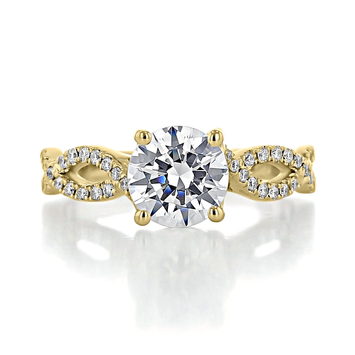 Calista | Round Diamond Twist Engagement Ring featuring a round center diamond set in a gold split-twist band encrusted with micro-prong-set diamonds.
