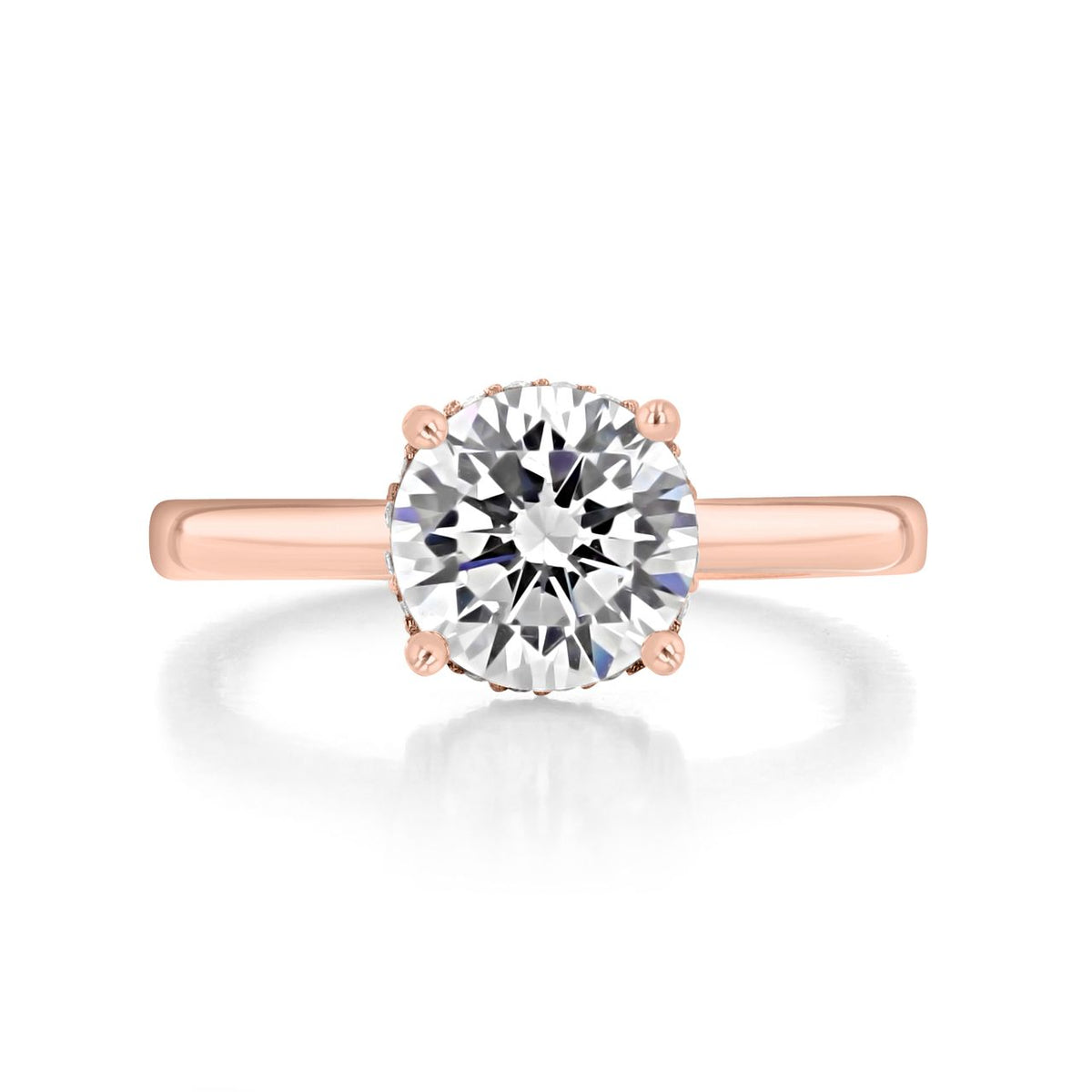 Kaia | Round Solitaire Engagement Ring featuring a round solitaire diamond set in an 18K rose gold band with a four-prong setting.