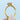 Tacori Coastal Crescent | Oval Solitaire Engagement Ring - P101OV75X55 featuring an oval solitaire diamond with accents along the band and halo setting, held between two fingers.