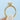 A yellow gold Tacori Coastal Crescent | Pear Solitaire Engagement Ring - P104PS9X6Y featuring a pear-shaped diamond solitaire and a band accented with pavé diamonds and intricate metalwork.