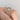 Side view of a Simply Tacori | Round Solitaire Engagement Ring - 2652RD65 on a finger, featuring a round solitaire diamond in a cathedral setting with a diamond-studded gallery and band.