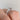 A Simply Tacori | Princess Solitaire Engagement Ring - 2650PR55W featuring a princess-cut solitaire diamond and diamond-accented setting worn on a finger.