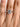 Simply Tacori Emerald Solitaire Engagement Ring - 2650EC75X55W emerald-cut solitaire engagement ring on a finger.