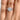 A round-cut diamond Solitaire Proposal Ring | SO38 worn on a finger.