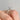 Icing On The Ring Solitaire Proposal Ring | SO38 featuring a round diamond in a four-prong setting on a 14k rose gold band, worn on a finger.