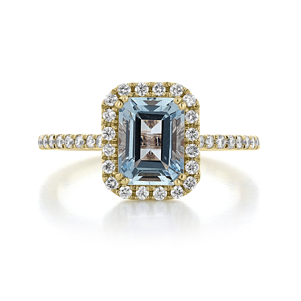 Makur Aquamarine Engagement Ring | R1052-4AQ featuring an emerald-cut aquamarine in a yellow gold setting with a halo and pavé-set diamonds on the band.