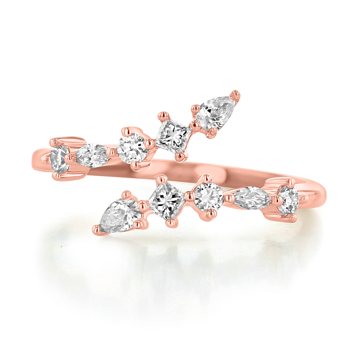 Makur Prong Set Diamond Bypass Ring | R1144, a rose gold bypass engagement ring featuring two overlapping rows of prong-set diamonds in pear, round, and square shapes.