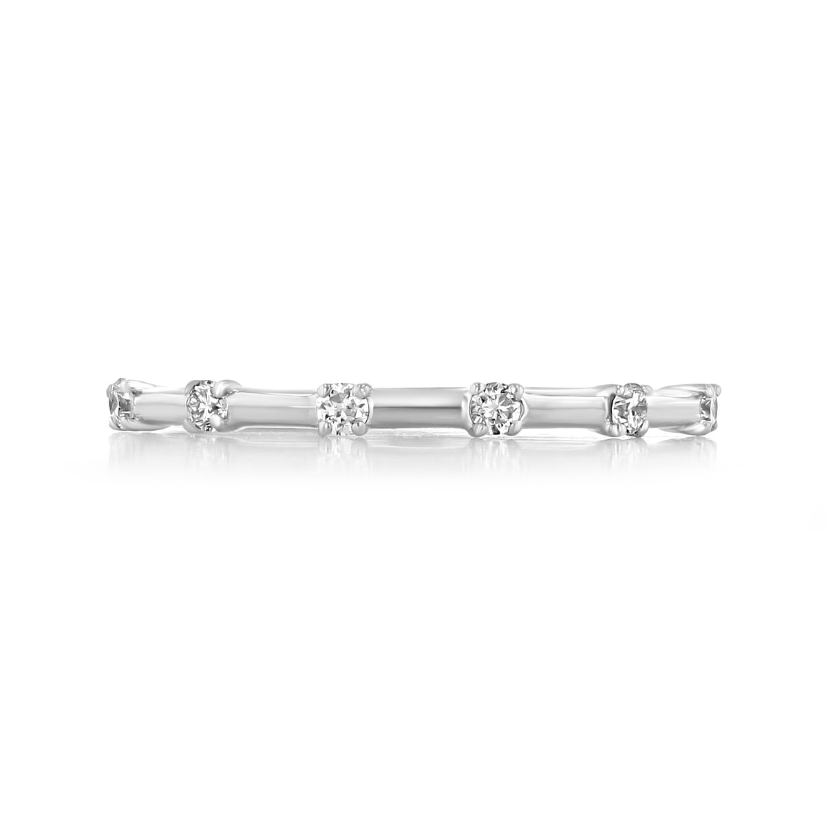 A thin 14k white gold Mavis | Prong-Set Diamond Wedding Band featuring five round diamonds in prong settings.