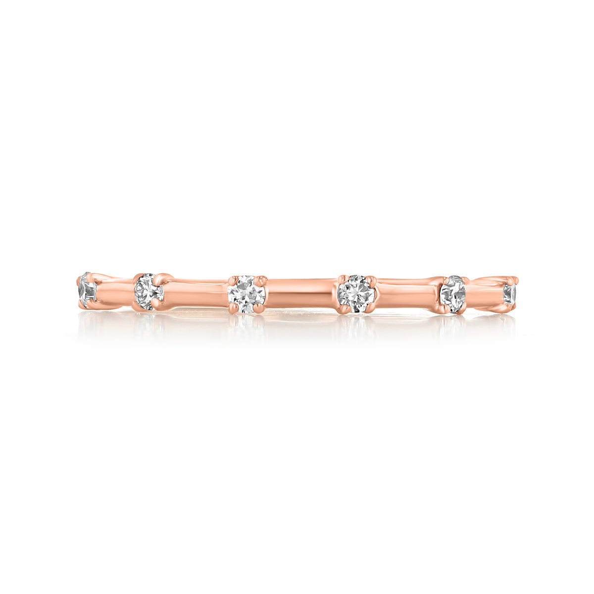 Mavis prong-set diamond wedding band in 14k rose gold featuring round prong-set diamonds spaced evenly along the ring.