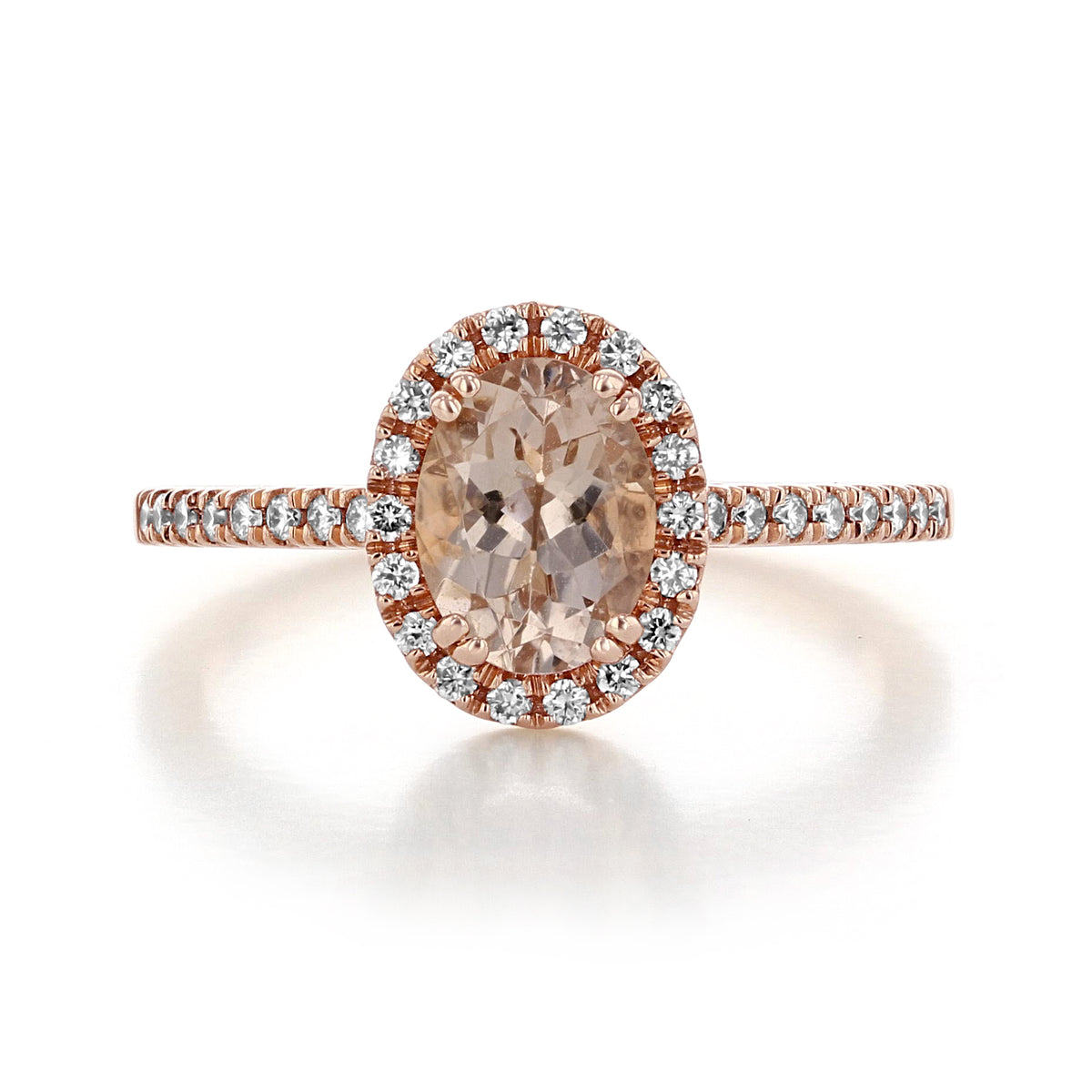 Makur Morganite Engagement Ring | R861-4 featuring an oval morganite stone in a rose gold setting with a diamond halo and pavé-set diamonds along the band.