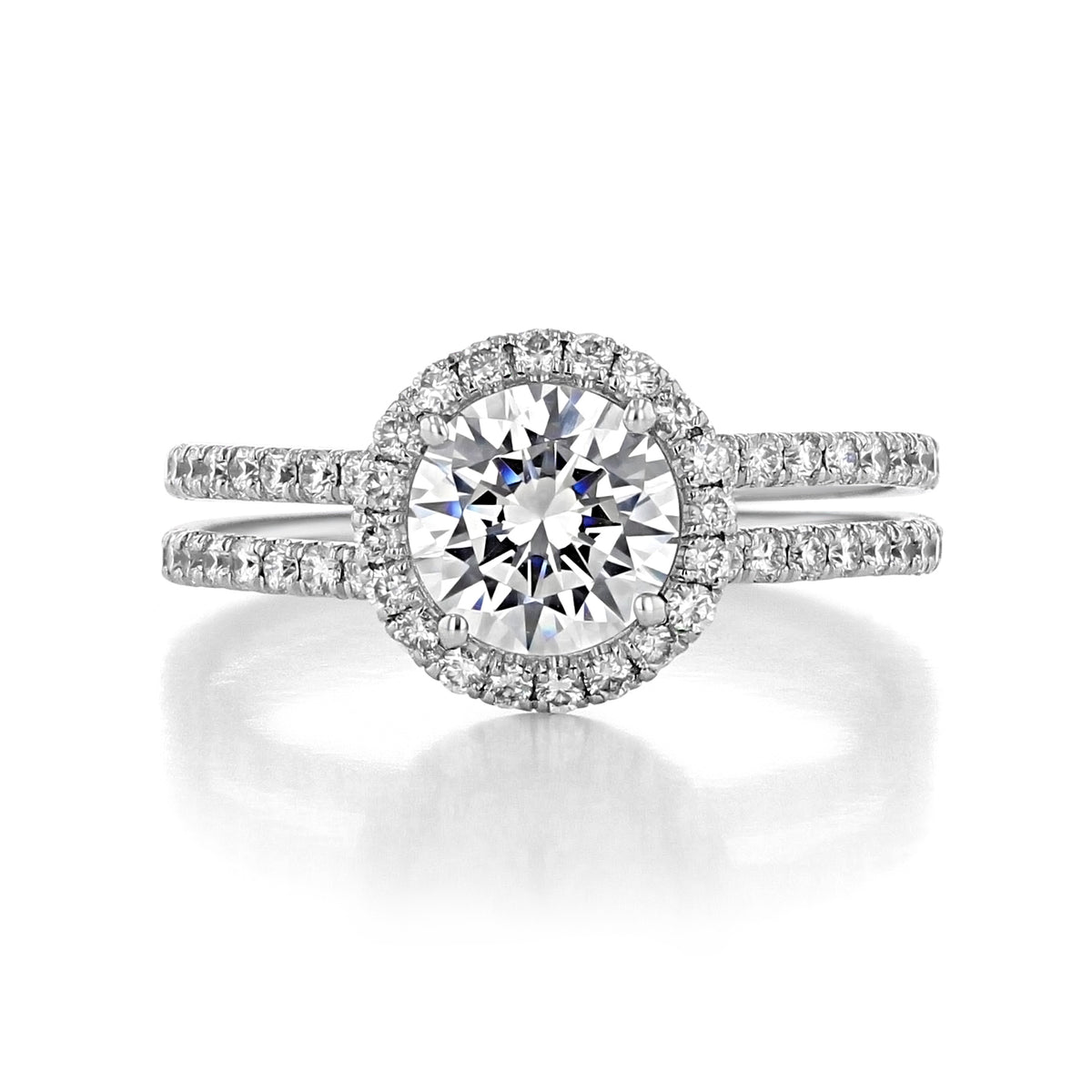 A Danhov Solo Filo | Halo Engagement Ring - SE113 featuring a round diamond in a halo setting on a split-shank band pave-set with sparkling diamonds.