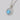 A Gemma Bloom Neo-Turquoise Fashion Necklace | SN14005 featuring a circular silver pendant with a scalloped edge and a round, faceted stone, suspended from a silver chain with a small floral accent.
