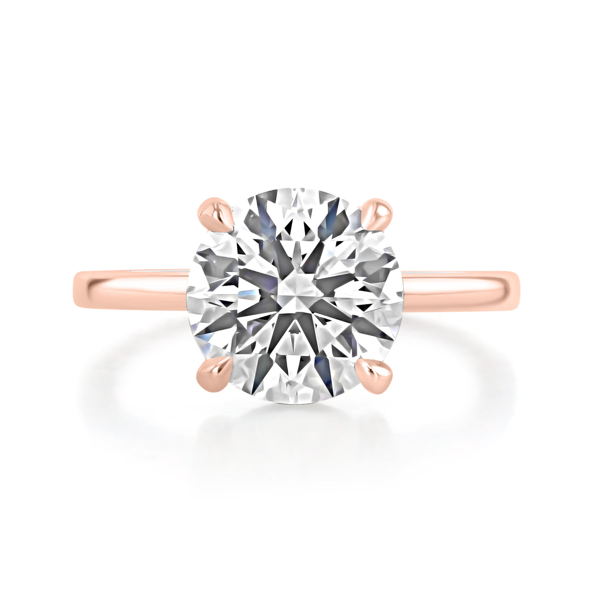 Hope | Round Solitaire Engagement Ring in 14k rose gold, top view of a round center diamond in a four-prong setting.