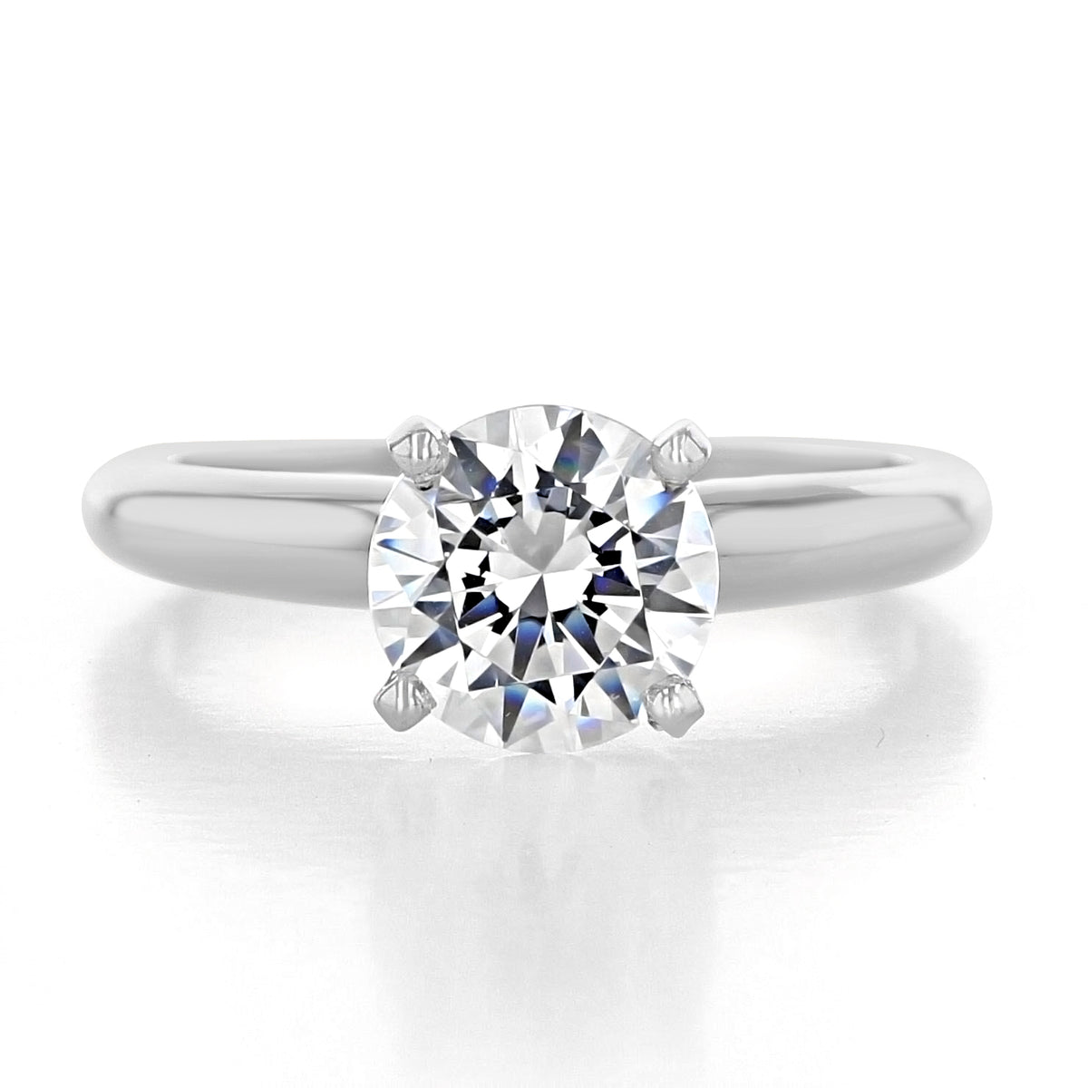 Icing On The Ring Solitaire Proposal Ring | SO38 featuring a round brilliant-cut diamond solitaire in a silver-toned metal band with a four-prong setting.