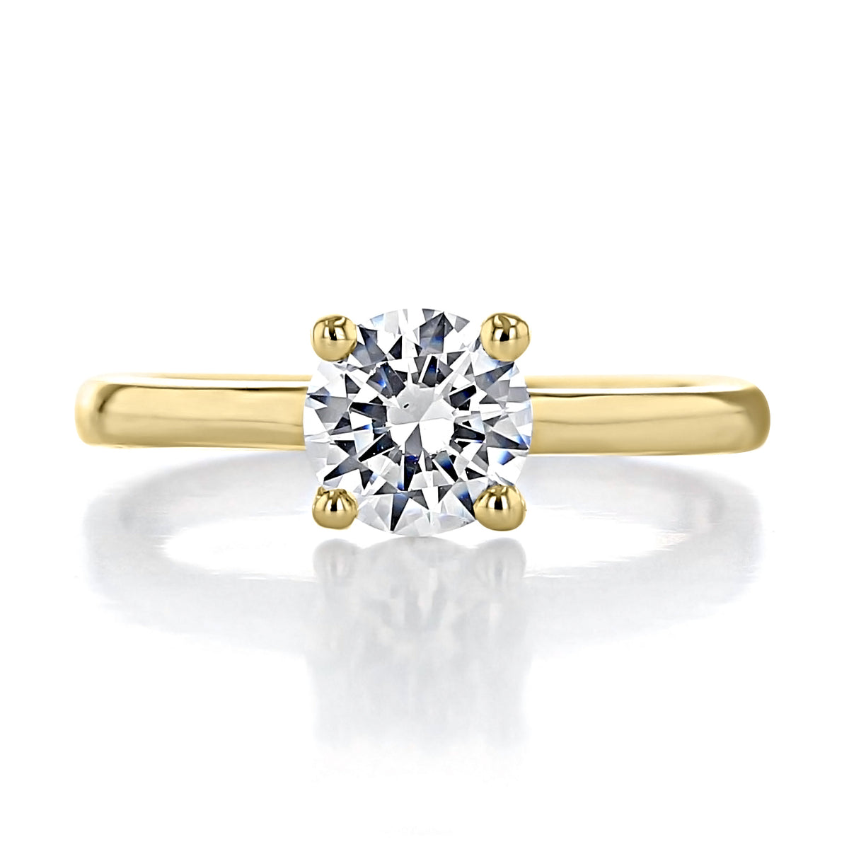 Amara | Round Solitaire Engagement Ring featuring a minimal round brilliant-cut diamond on a plain gold band.