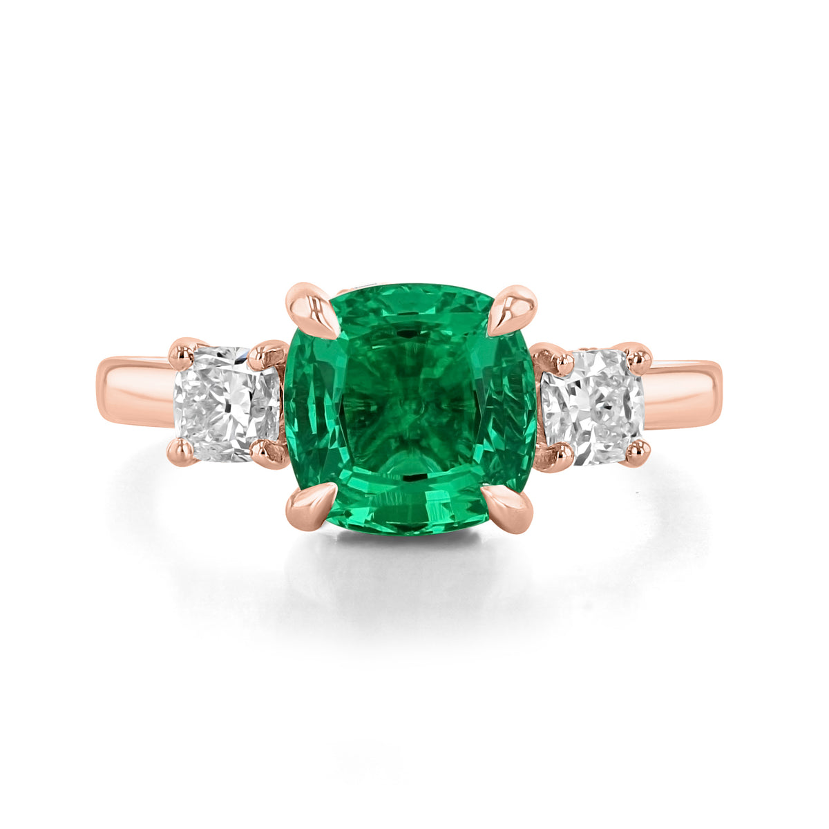 Emerald Three-Stone Engagement Ring | TR97 in rose gold featuring a large square-cut lab-created emerald flanked by two smaller cushion-cut diamonds.