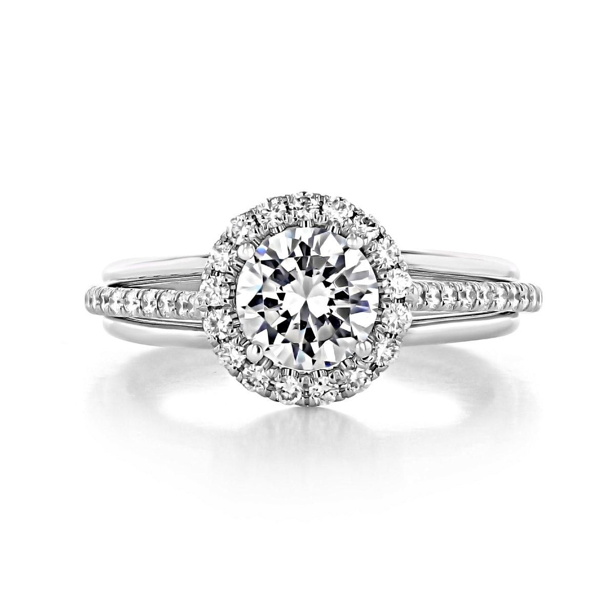 Danhov Unito | Halo Engagement Ring - UE112 featuring a handcrafted round-cut center stone surrounded by a diamond halo, with diamonds set along the split shank band.